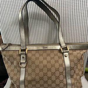 Authentic Gucci monogram canvas Medium Abbey Tote with Gold leather trim